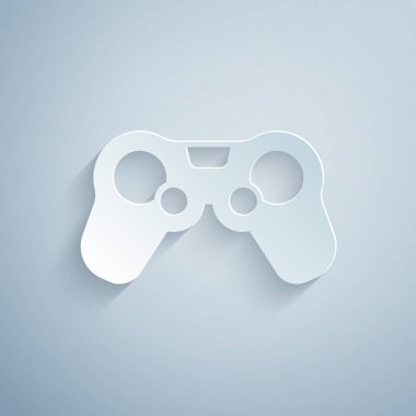 Kağıt kesiği Gamepad simgesi gri arkaplanda izole edildi. Oyun kontrolörü. Kağıt sanatı tarzı. Vektör
