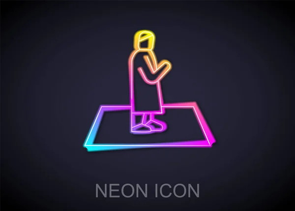 Glowing Neon Line Muslim Man Prays Carpet Icon Isolated Black — Stock Vector