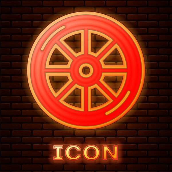 Glowing neon Bicycle wheel icon isolated on brick wall background. Bike race. Extreme sport. Sport equipment.  Vector.