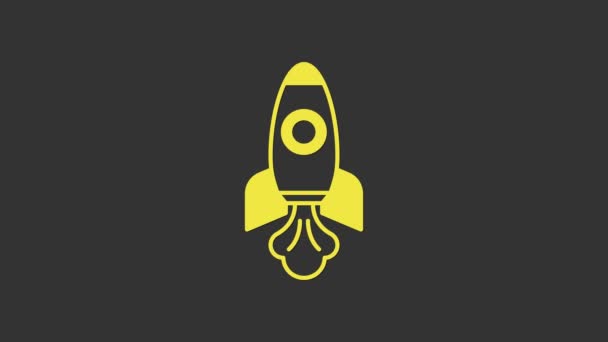 Yellow Rocket ship icon isolated on grey background. Space travel. 4K Video motion graphic animation — Stock Video