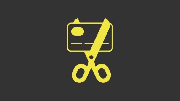 Yellow Scissors cutting a credit card icon isolated on grey background. Online payment. Cash withdrawal. Financial operations. Shopping sign. 4K Video motion graphic animation — Stock Video