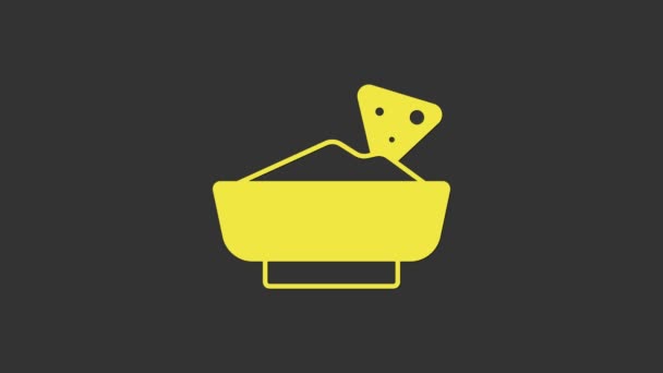 Yellow Nachos in bowl icon isolated on grey background. Tortilla chips or nachos tortillas. Traditional mexican fast food menu. 4K Video motion graphic animation