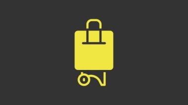 Seyahat simgesi için sarı bavul gri arkaplanda izole edildi. Seyahat bagaj tabelası. Seyahat bagaj ikonu. 4K Video hareketli grafik canlandırması