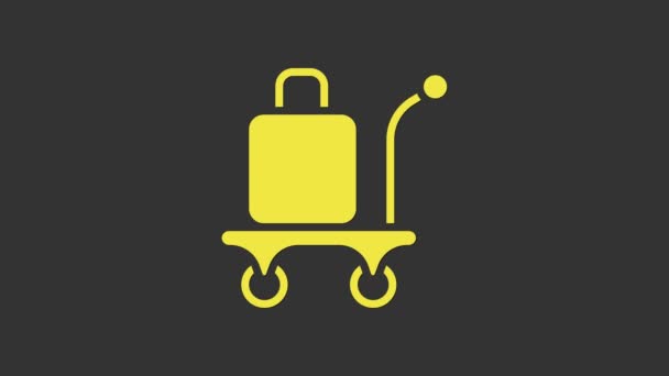 Gele Trolley koffer pictogram geïsoleerd op grijze achtergrond. Reisbagagebord. Reisbagage icoon. 4K Video motion grafische animatie — Stockvideo