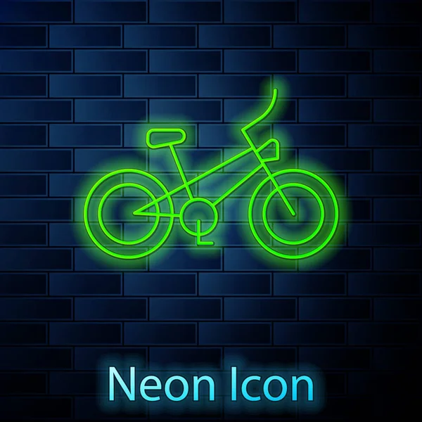 Leuchtende Leuchtschrift Fahrrad-Symbol isoliert auf Backsteinwand Hintergrund. Radrennen. Extremsport. Sportgeräte. Vektor — Stockvektor