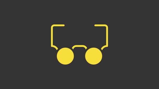 Ikona Žluté brýle izolované na šedém pozadí. Symbol brýlového rámu. Grafická animace pohybu videa 4K — Stock video