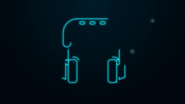 Icono de auriculares de línea de neón brillante aislado sobre fondo negro. Auriculares. Concepto para escuchar música, servicio, comunicación y operador. Animación gráfica de vídeo 4K — Vídeo de stock