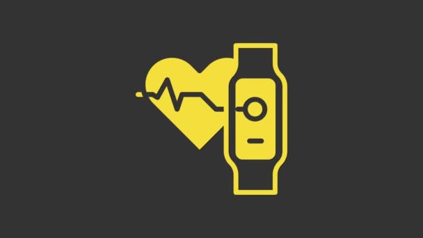 Yellow Smart watch showing heart beat rate icon isolated on grey background. Fitness App concept. 4K Video motion graphic animation — Stock Video