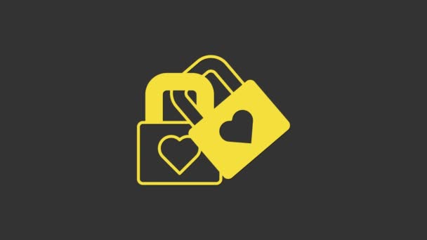 Bloqueio amarelo com ícone de coração isolado no fundo cinza. Coração trancado. Símbolo de amor e sinal de fechadura. Símbolo do dia dos namorados. Animação gráfica em movimento de vídeo 4K — Vídeo de Stock