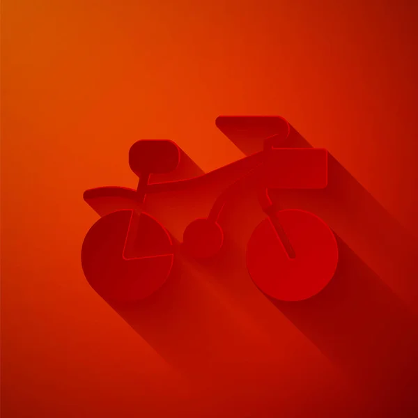 Papel cortado ícone de bicicleta isolado no fundo vermelho. Corrida de bicicleta. Desporto extremo. Equipamento desportivo. Estilo de arte de papel. Vetor — Vetor de Stock