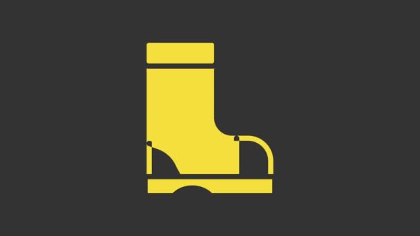 Icono de bota de goma impermeable amarillo aislado sobre fondo gris. Botas de goma para el clima lluvioso, la pesca, la jardinería. Animación gráfica de vídeo 4K — Vídeo de stock