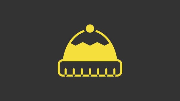 灰色の背景に隔離された黄色の冬の帽子のアイコン。4Kビデオモーショングラフィックアニメーション — ストック動画