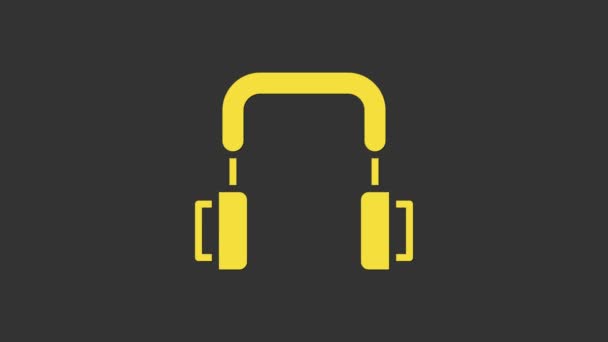 黄色のヘッドフォンアイコンは灰色の背景に隔離されています。イヤフォン。音楽、サービス、コミュニケーション、オペレーターの話を聞くためのコンセプト。4Kビデオモーショングラフィックアニメーション — ストック動画