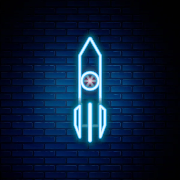 Glowing neon line Nuclear rocket icon isolated on brick wall background. Rocket bomb flies down. Colorful outline concept. Vector — Stock Vector