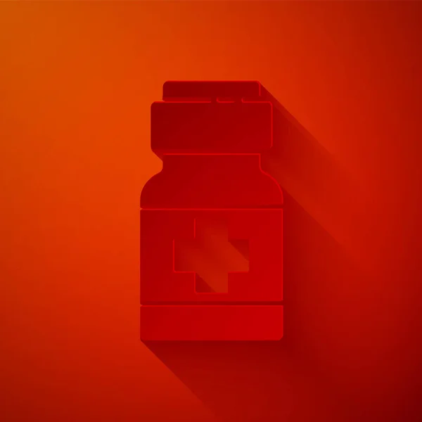 Papel corte medicina botella y pastillas icono aislado sobre fondo rojo. Paquete médico para tabletas, vitaminas, antibióticos, aspirina. Estilo de arte de papel. Vector. — Vector de stock