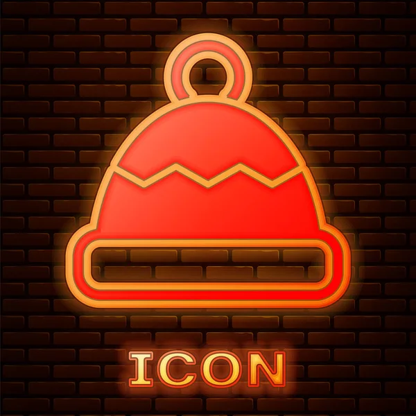 Glowing neon Beanie hat icon isolated on brick wall background. Vector — Stock Vector