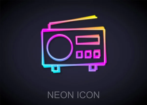 Gloeiende neon lijn Radio met antenne pictogram geïsoleerd op zwarte achtergrond. Vector — Stockvector