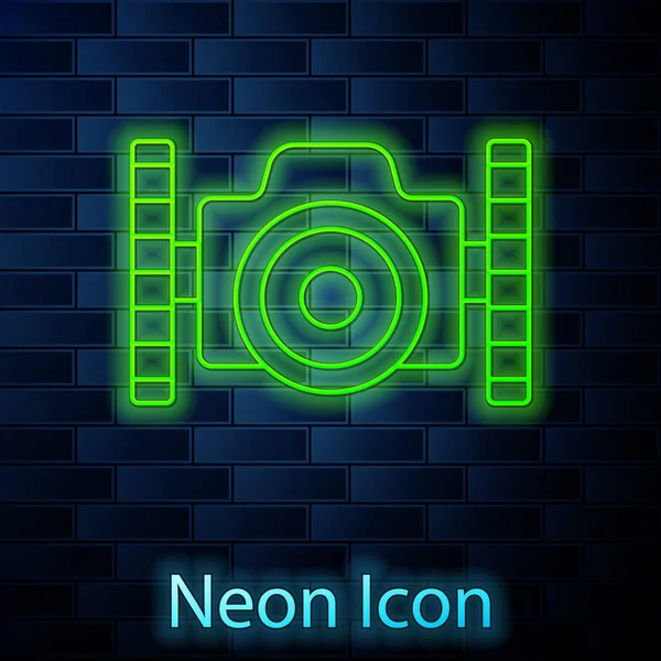 Glowing neon line Photo camera for diver icon isolated on brick wall background. Foto camera icon. Diving underwater equipment. Vector — Stock Vector