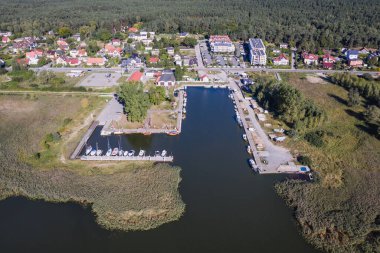 Aerial photo of Vistula Lagoon in Katy Rybackie village located on the Vistula Spit between lagoon and Baltic Sea in Pomerania region of Poland clipart