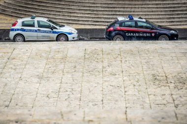 Noto, Italy - December 15, 2016: Carabinieri gendarmerie and Municipal police cars in historic part of Noto city, Sicily in Italy clipart