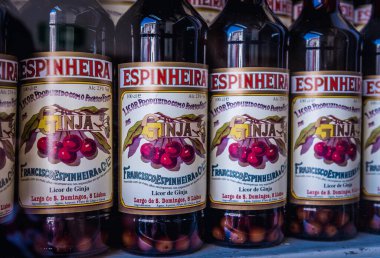 Lisbon, Portugal - October 9, 2018: Bottles in A Ginjinha bar located on Sao Domingos Square, served Ginja liqueur in Lisbon capital city clipart