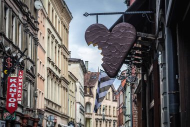 Torun, Poland - February 20, 2019: Gingerbread sign over the entrance of sweet shop in historic part of Torun clipart