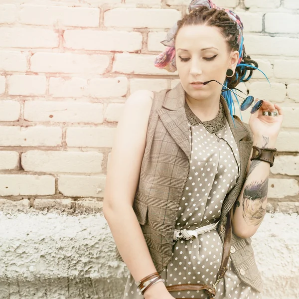 Portrait young active girl of the hipster outdoors — Stock Photo, Image