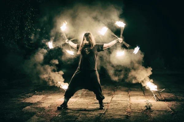 Active European guy carries out tricks for fire show night — Stock Photo, Image