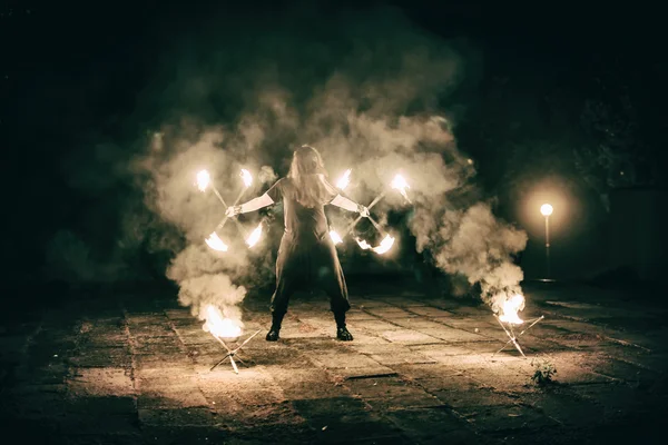 Active European guy carries out tricks for fire show night — Stock Photo, Image