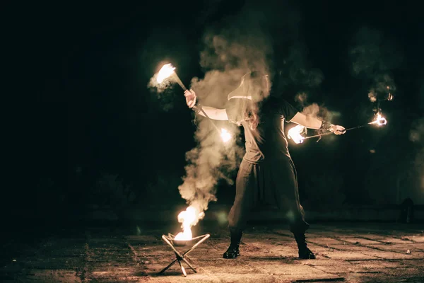 Active European guy carries out tricks for fire show night — Stock Photo, Image