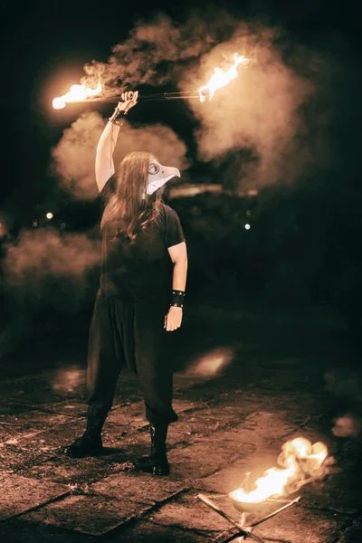 Active European guy carries out tricks for fire show night — Stock Photo, Image