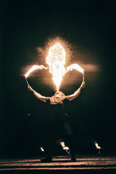 Active European guy carries out tricks for fire show night — Stock Photo, Image