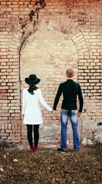 Unusual young pair of people love from a back — ストック写真