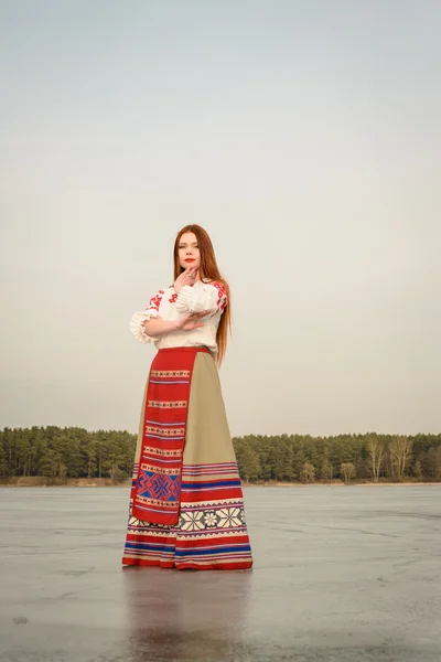 Young woman in Slavic Belarusian national original suit outdoors — Stock Photo, Image