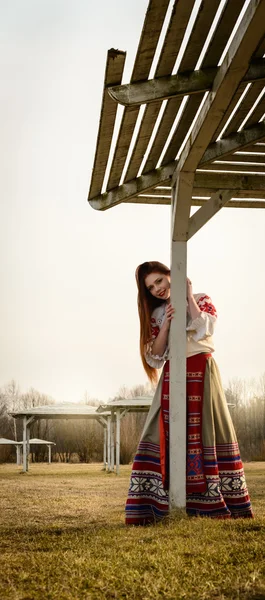 Young woman in Slavic Belarusian national original suit outdoors — Stock Photo, Image