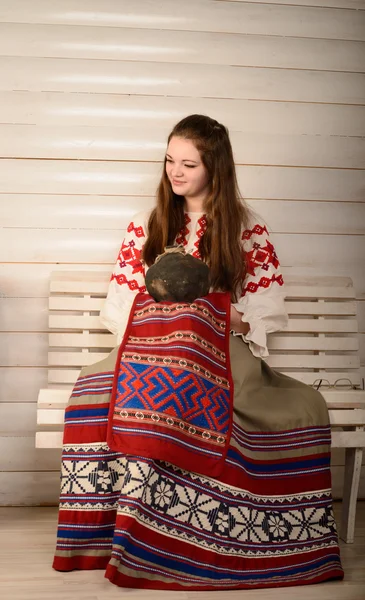 Young woman in Slavic Belarusian national original suit studio — Stock Photo, Image