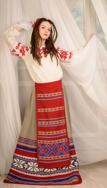 Young woman in Slavic Belarusian national original suit studio — Stock Photo, Image