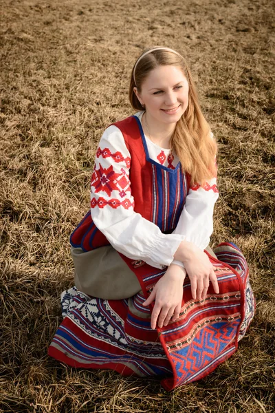 Young woman in Slavic Belarusian national original suit outdoors — Stock Photo, Image