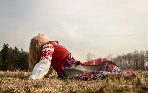 Young woman in Slavic Belarusian national original suit outdoors — Stock Photo, Image