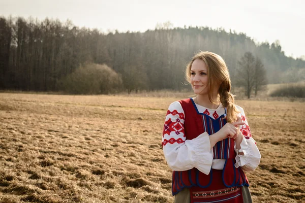 Young woman in Slavic Belarusian national original suit outdoors — Stock Photo, Image