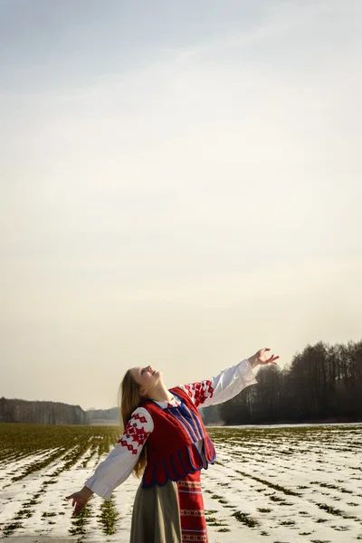 Young woman in Slavic Belarusian national original suit outdoors Royalty Free Stock Photos