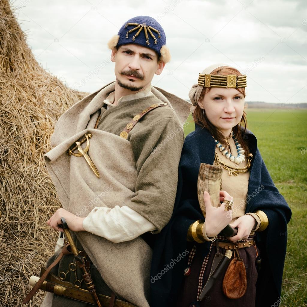 woman and man in ethnic suit  context historical reconstruction