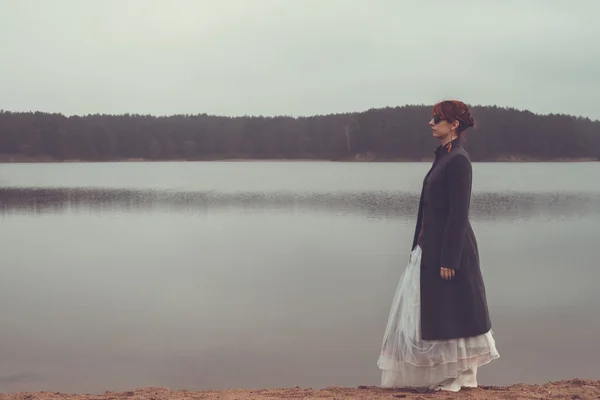Unusual woman in long skirt as concept outdoors — ストック写真