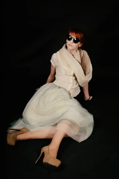 Unusual woman studio with red hair and sunglasses — Stock Photo, Image