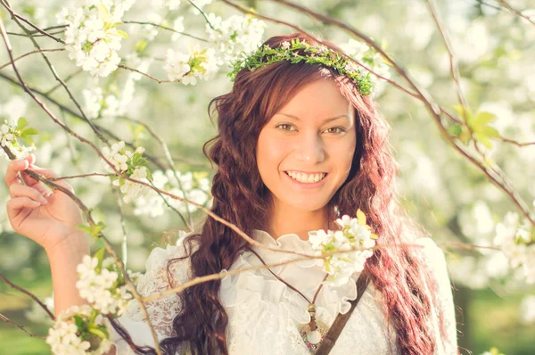 Boho Girl in cherry blossom — Stock Photo, Image