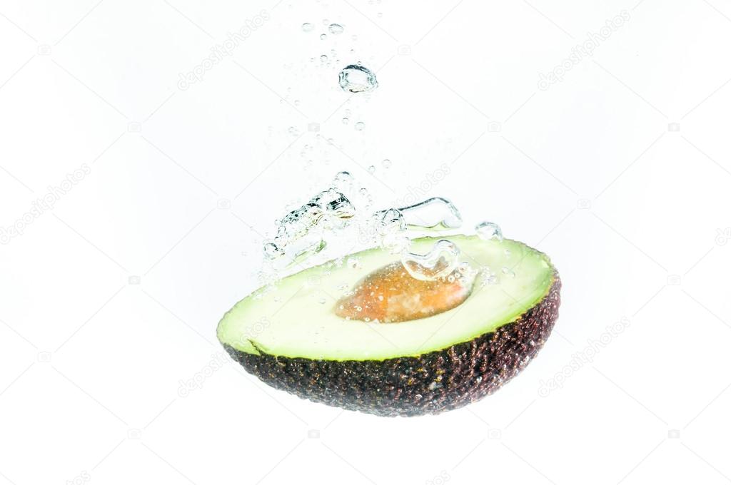 Avocado fall deeply under water — Stock Photo © runzelkorn 60537947