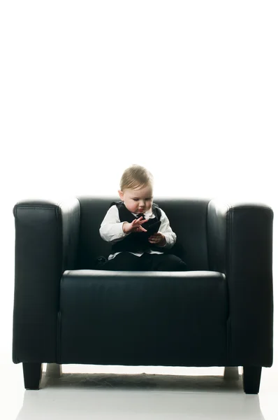 Baby girl on executive chair — Stock Photo, Image