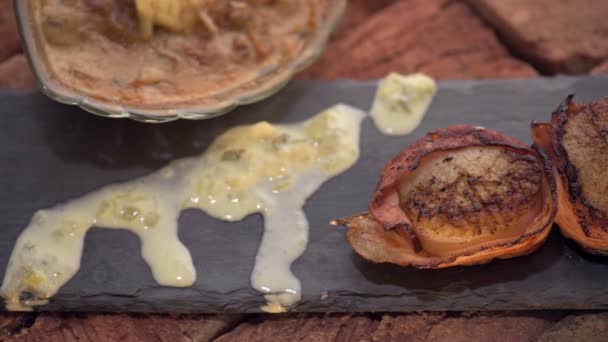 Closeup of fried scallops skewer wrapped in bacon — Stock Video