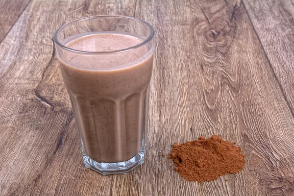 Blended smoothie with ingredients on wooden table — Stock Photo, Image