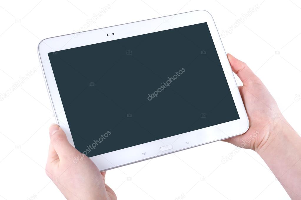 Tablet in the women hands on a white background